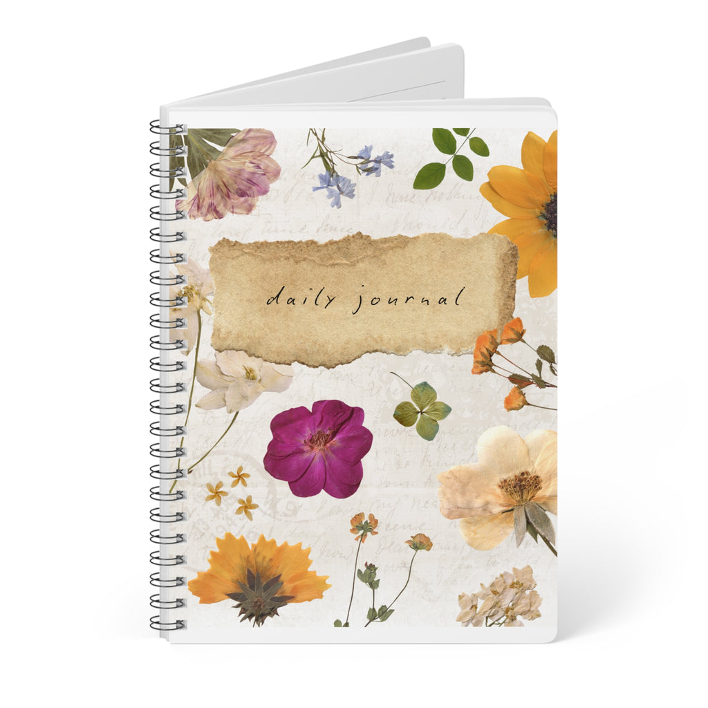 A5 floral wirebound daily journal notebook with blank pages behind, white cover with flower artwork