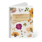 A5 floral wirebound daily journal notebook with blank pages behind, white cover with flower artwork