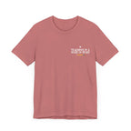 Mauve unisex t-shirt with “Teaching is a work of heart” heart-and-text graphic