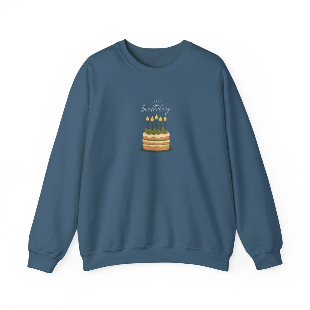 Blue crewneck sweatshirt with front birthday cake graphic and lit candles.