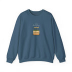 Blue crewneck sweatshirt with front birthday cake graphic and lit candles.