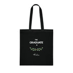 Black graduation tote bag front print with “THE GRADUATE”, green laurel, and name Hiba