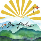 Close-up of sunrise rays and watercolor mountain landscape graphic on mug