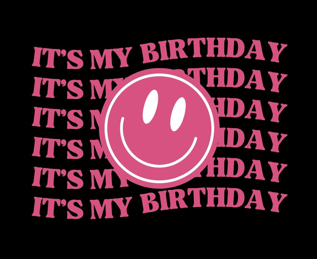Pink 'It's my birthday' text with smiley face circle graphic on black hoodie
