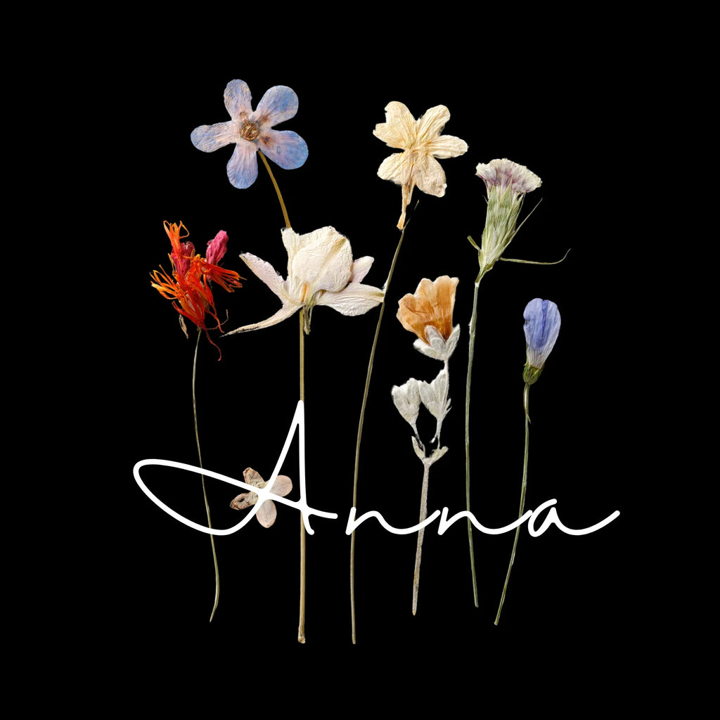Dried wildflower design artwork with handwritten "Anna" text.