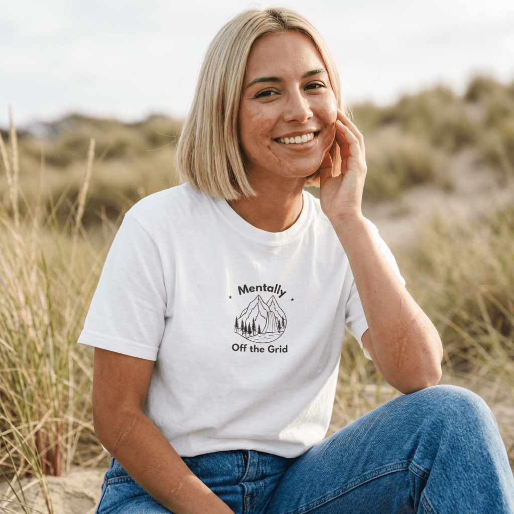 White custom T-shirt with mountain graphic and text "Mentally" and "Off the Grid"