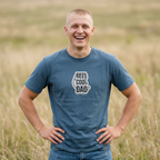 Blue crewneck graphic T-shirt with small 'REEL COOL DAD' logo, EST 2024