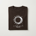 Dark brown graphic T-shirt with sun/moon emblem and 'wild soul Harriet' print