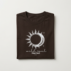 Dark brown graphic T-shirt with sun/moon emblem and 'wild soul Harriet' print