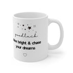 White mug with 'good luck' script, 'shine bright & chase your dreams' text and heart icon.