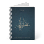 Dark teal A5 spiral notebook with sailboat cover art, 2026, and lined interior