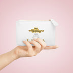 White mini clutch bag with gold zipper, Happy Birthday cake print, held in hand
