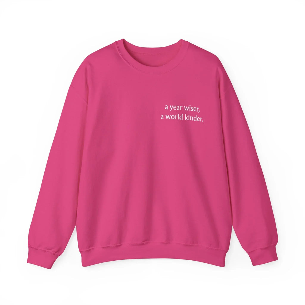 Pink birthday sweatshirt with 'a year wiser, a world kinder' print