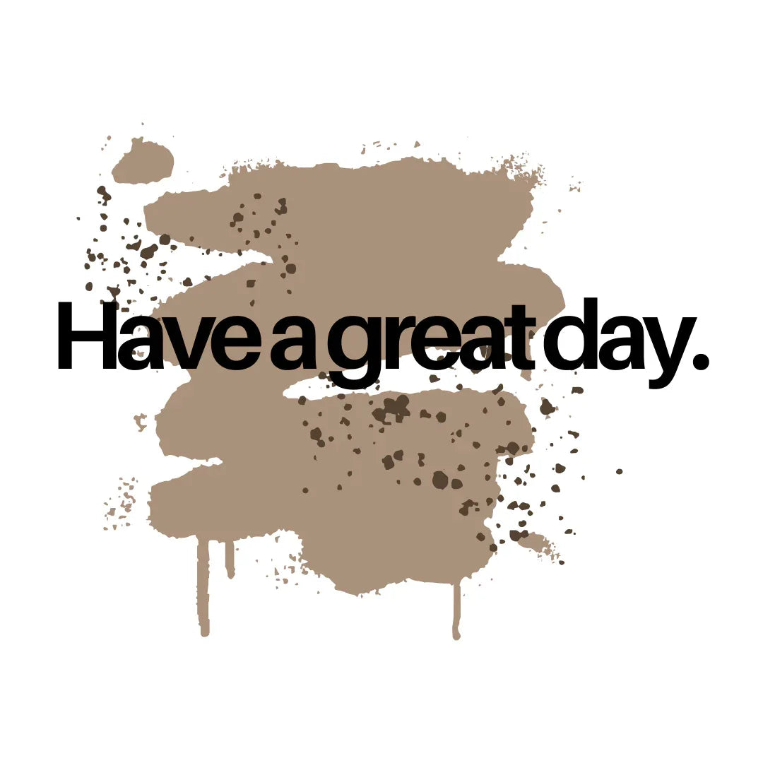 White tote bag close-up of brown paint splash with 'Have a great day' text