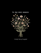 Black crew-neck t-shirt with centered botanical bouquet graphic and 'In my own season' text