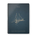 Dark teal A5 spiral notebook cover with sailboat illustration and 2026 text