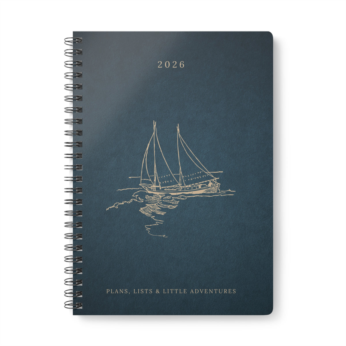 Dark teal A5 spiral notebook cover with sailboat illustration and 2026 text