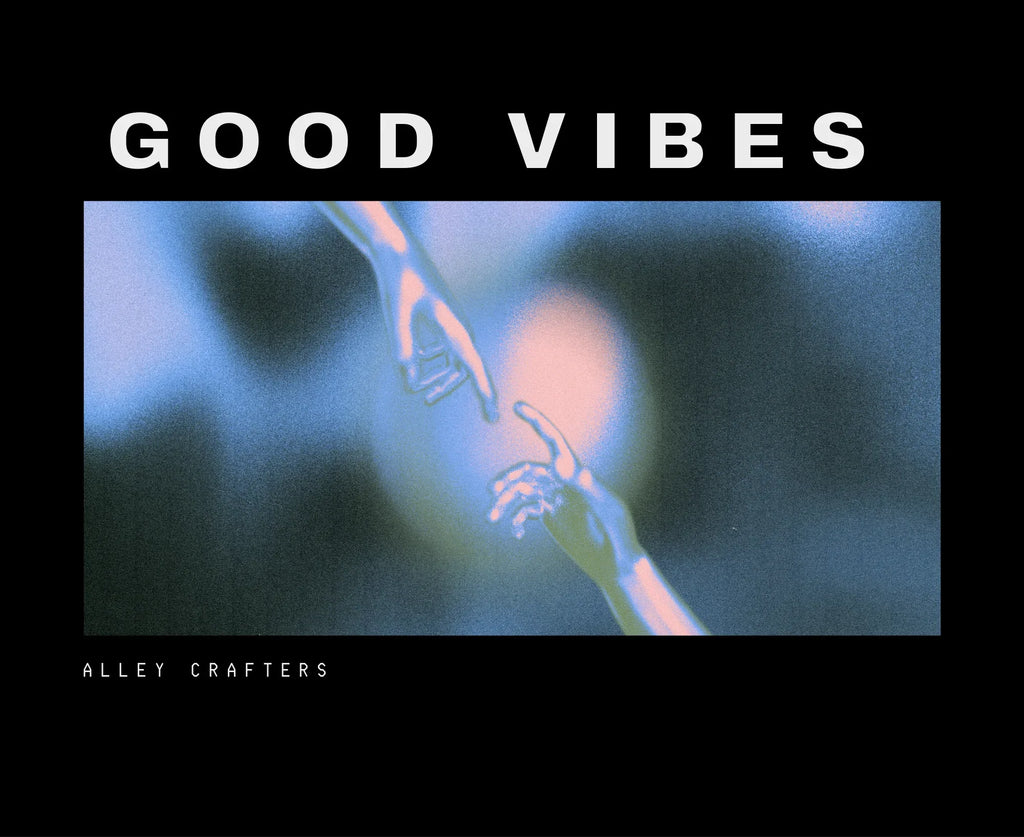 Close-up of black unisex hoodie graphic: 'GOOD VIBES' text and artwork