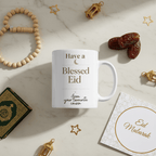 White mug with “Have a Blessed Eid” and “from your favourite cousin” in gold