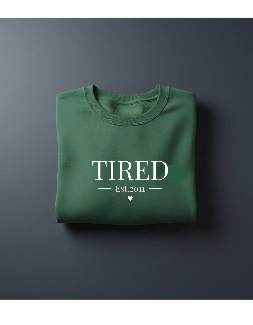 Green crewneck sweatshirt with 'TIRED' and 'Est.2011' text print