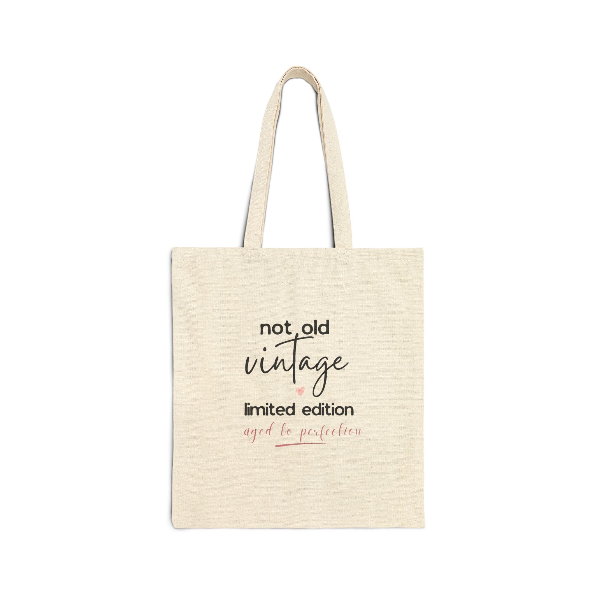 Natural canvas tote bag with 'not old vintage' and 'limited edition' front text
