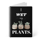 A5 spiral notebook with black cover, “I wet my plants” text and succulent pot artwork.
