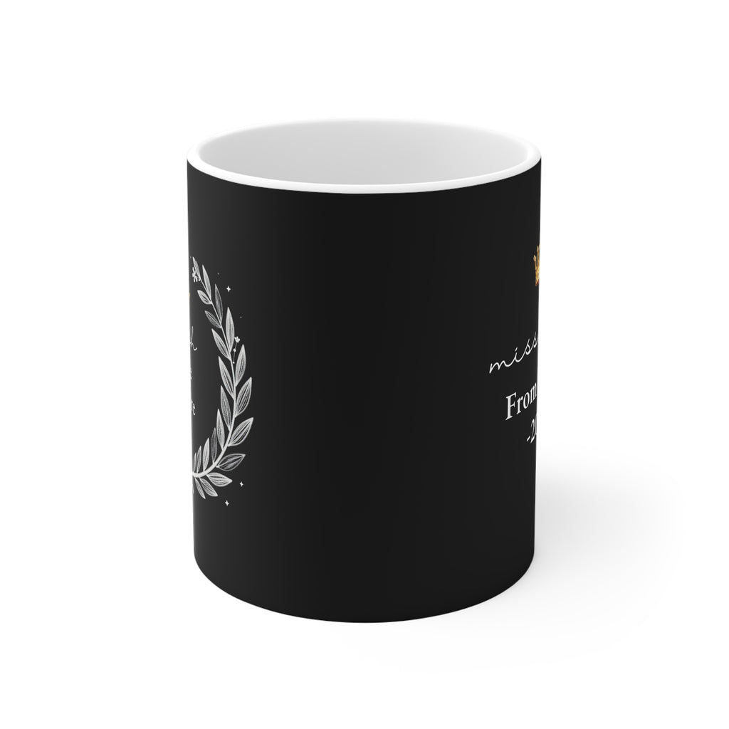 Black mug with laurel wreath and partial “Teach Love Inspire” lettering