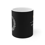 Black mug with laurel wreath and partial “Teach Love Inspire” lettering