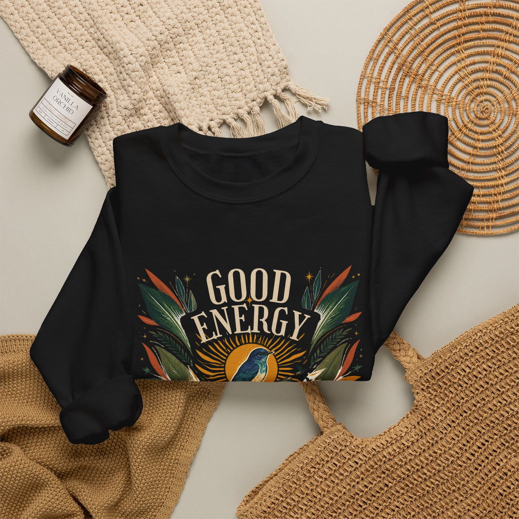 Black unisex sweatshirt with “GOOD ENERGY” botanical bird graphic on front
