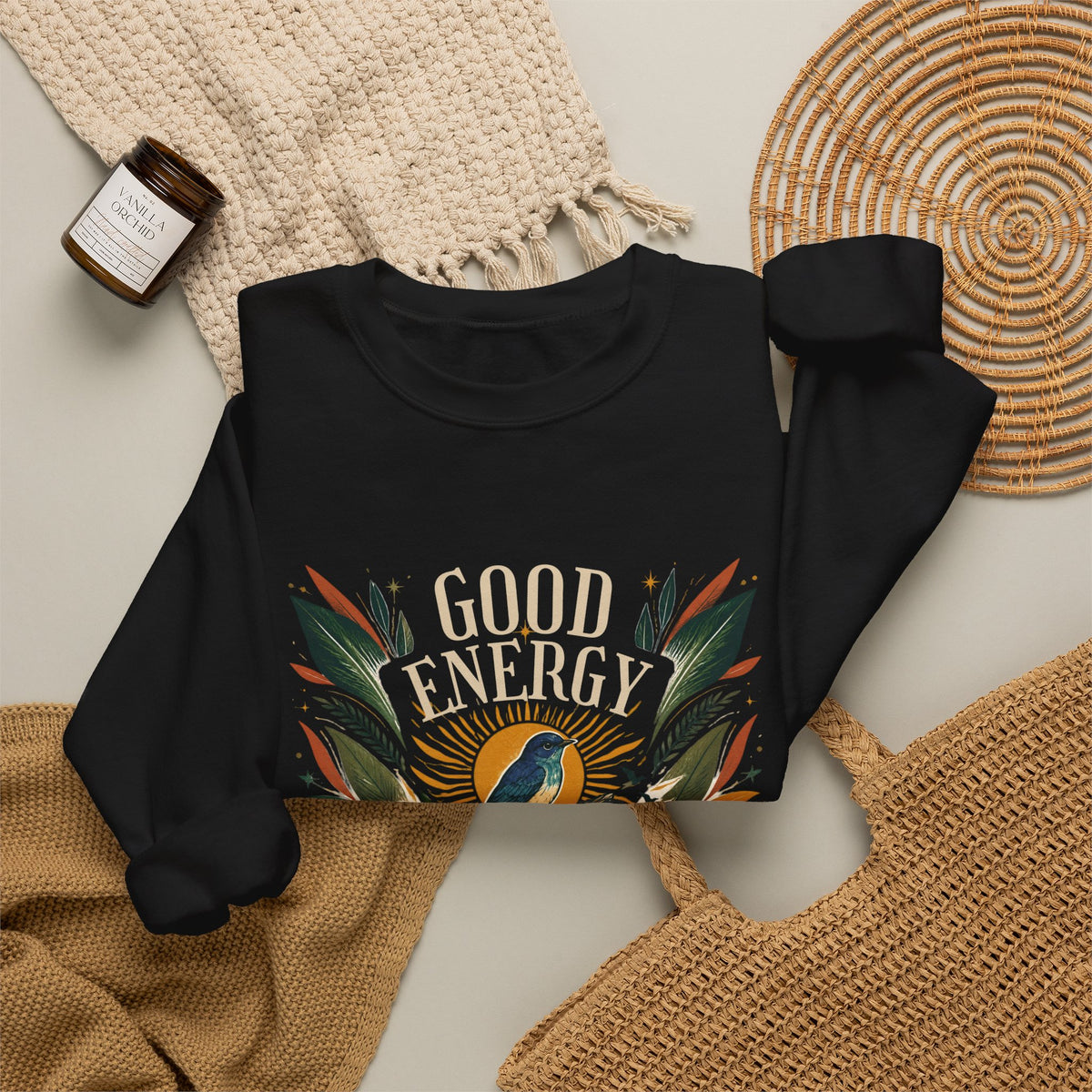 Black unisex sweatshirt with “GOOD ENERGY” botanical bird graphic on front