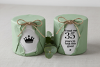 Green gift box-wrapped mug with twine bow, crown icon and '35 years to look good'