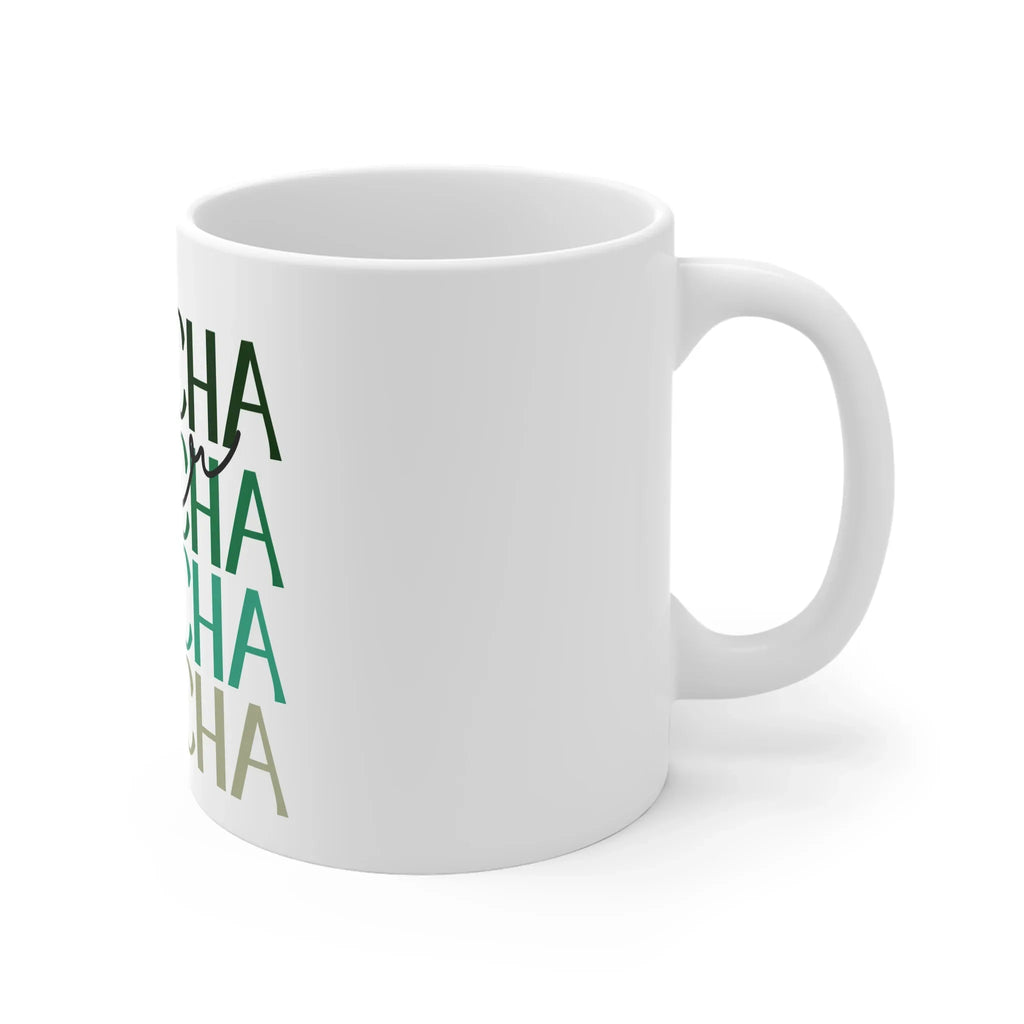 White ceramic matcha mug with green MATCHA design, angled side view