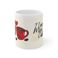 White coffee mug with red cup-and-heart illustration and 'I love you more than coffee'.