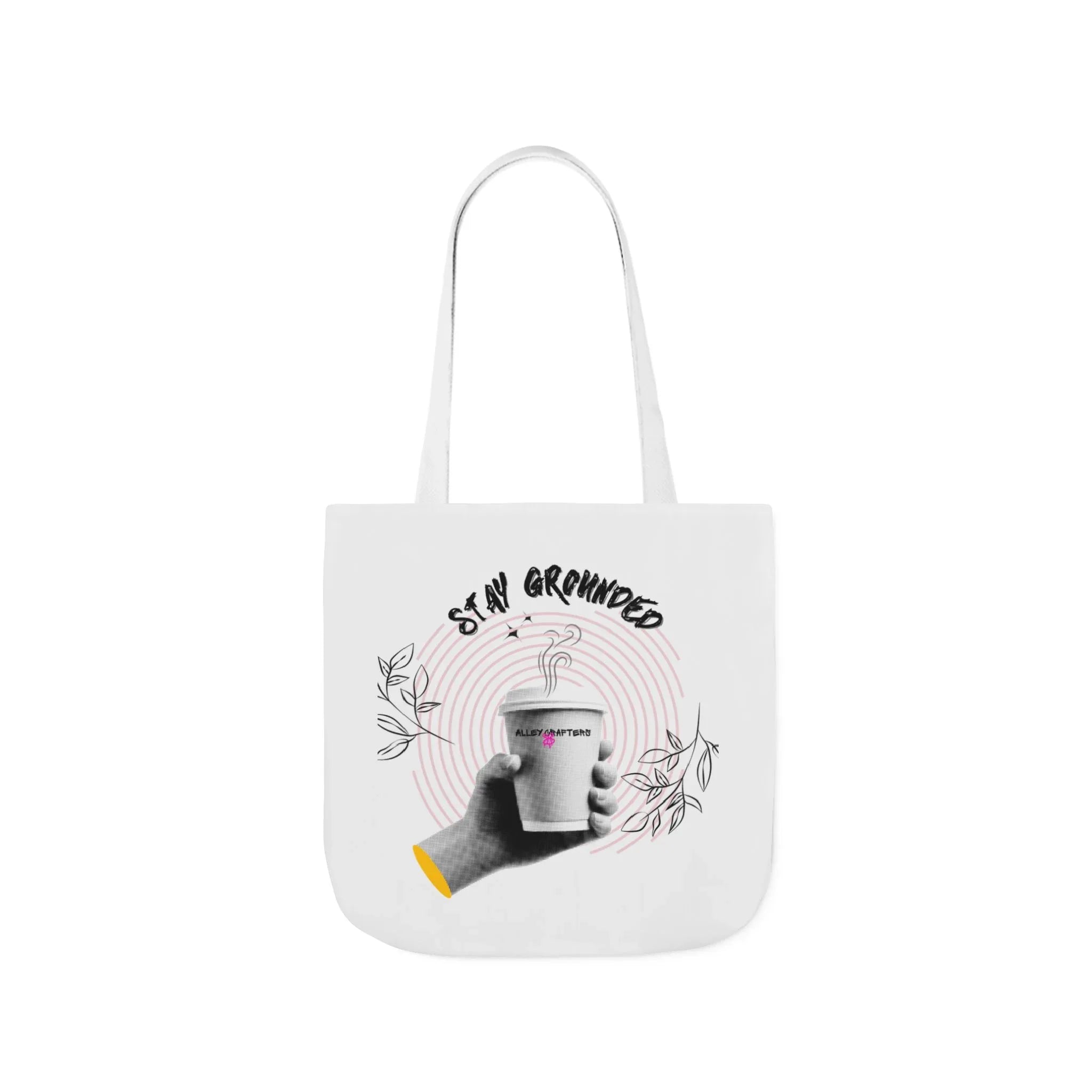 White coffee tote with white handles, “STAY GROUNDED” coffee mug illustration and leaves