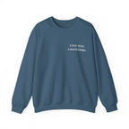 Slate blue birthday sweatshirt with 'a year wiser, a world kinder' print
