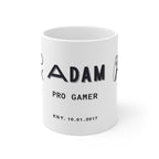 White gamer mug with black “ADAM”, “PRO GAMER”, and “EST. 10.01.2017” print