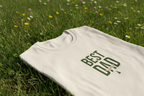 Light beige T-shirt with green "Best Dad" typography on the front