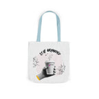 White coffee tote with light blue handles, “STAY GROUNDED” coffee mug print with leaves