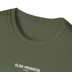 Olive green crewneck t-shirt with 'Slow Progress' text near chest, close-up