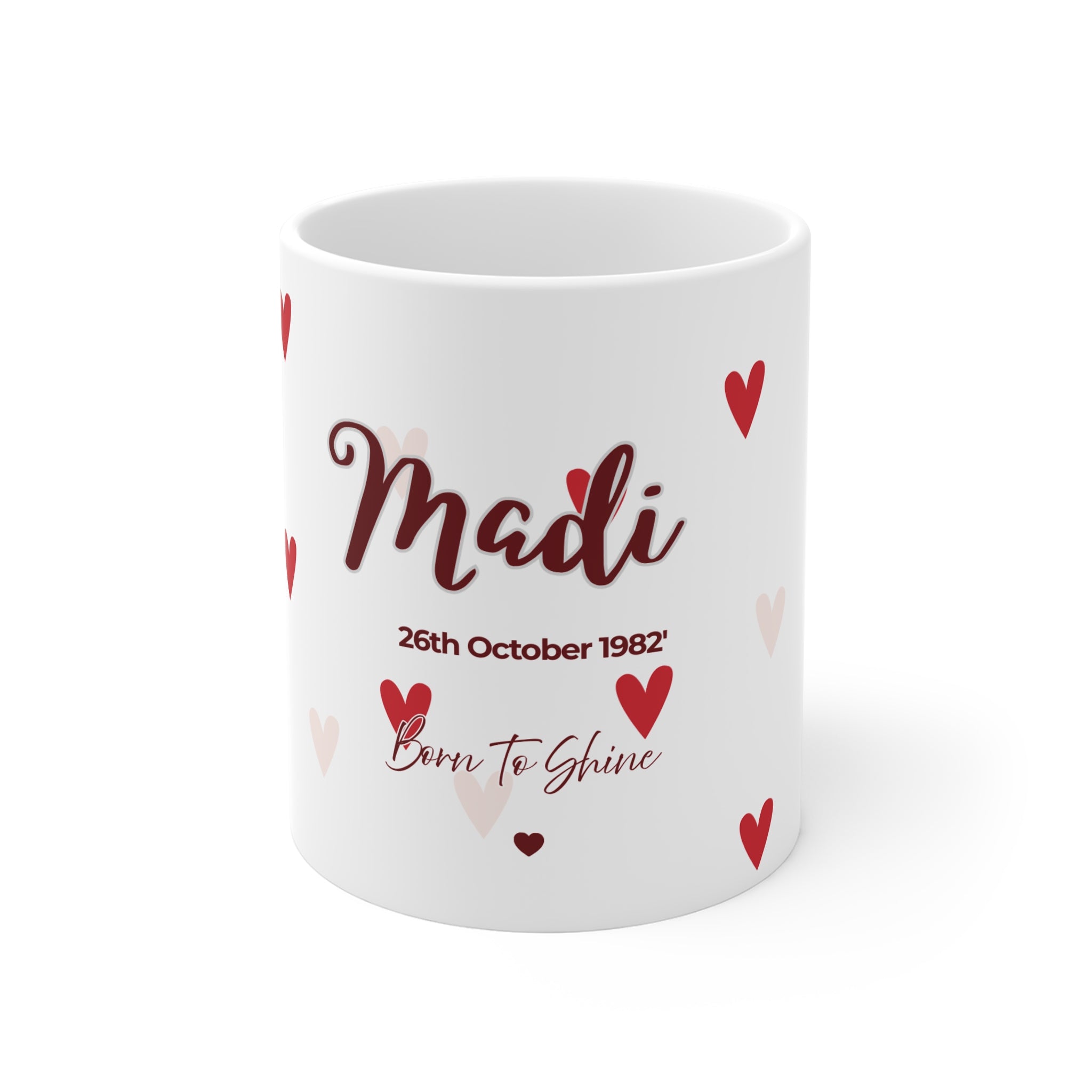 White mug with 'Madi' name and 'Born to Shine' text, red and light-pink hearts.