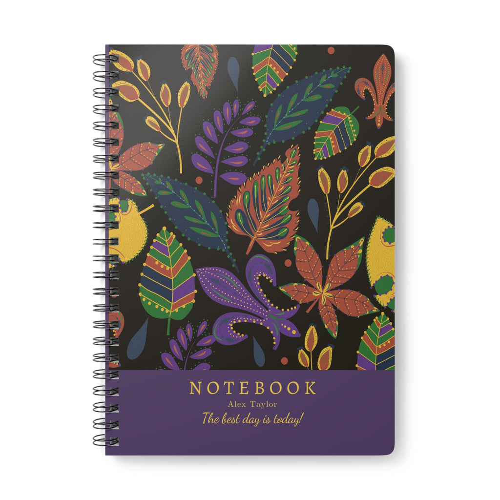 A5 boho leaf notebook with colorful floral cover and spiral binding, dark background