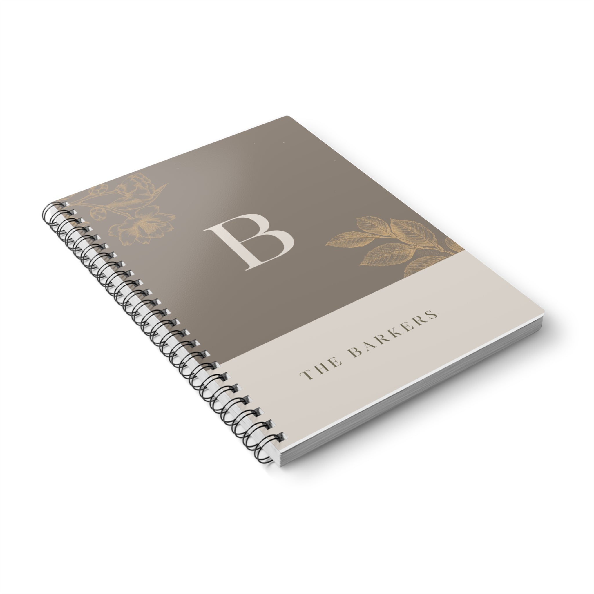 A5 notebook with taupe cover, gold monogram B, floral accents, and spiral binding.