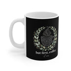 Black ceramic coffee mug with white rim and handle, illustrated coffee-cup with leaf wreath