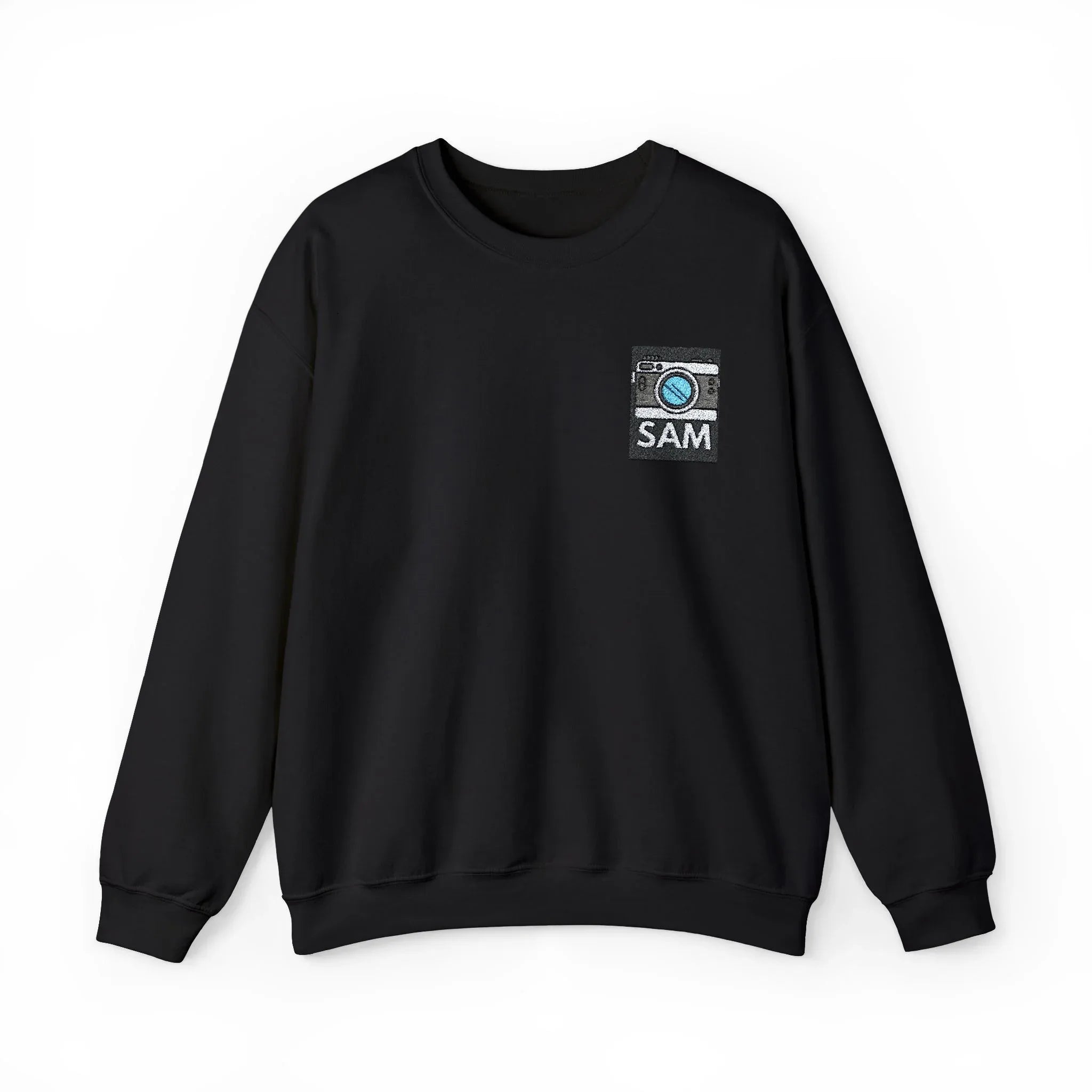 Black crewneck sweatshirt with small embroidered camera icon and name SAM at chest