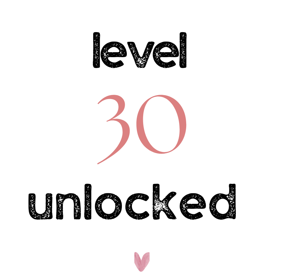 Ceramic mug with "level 30 unlocked" print in black, pink, and small heart