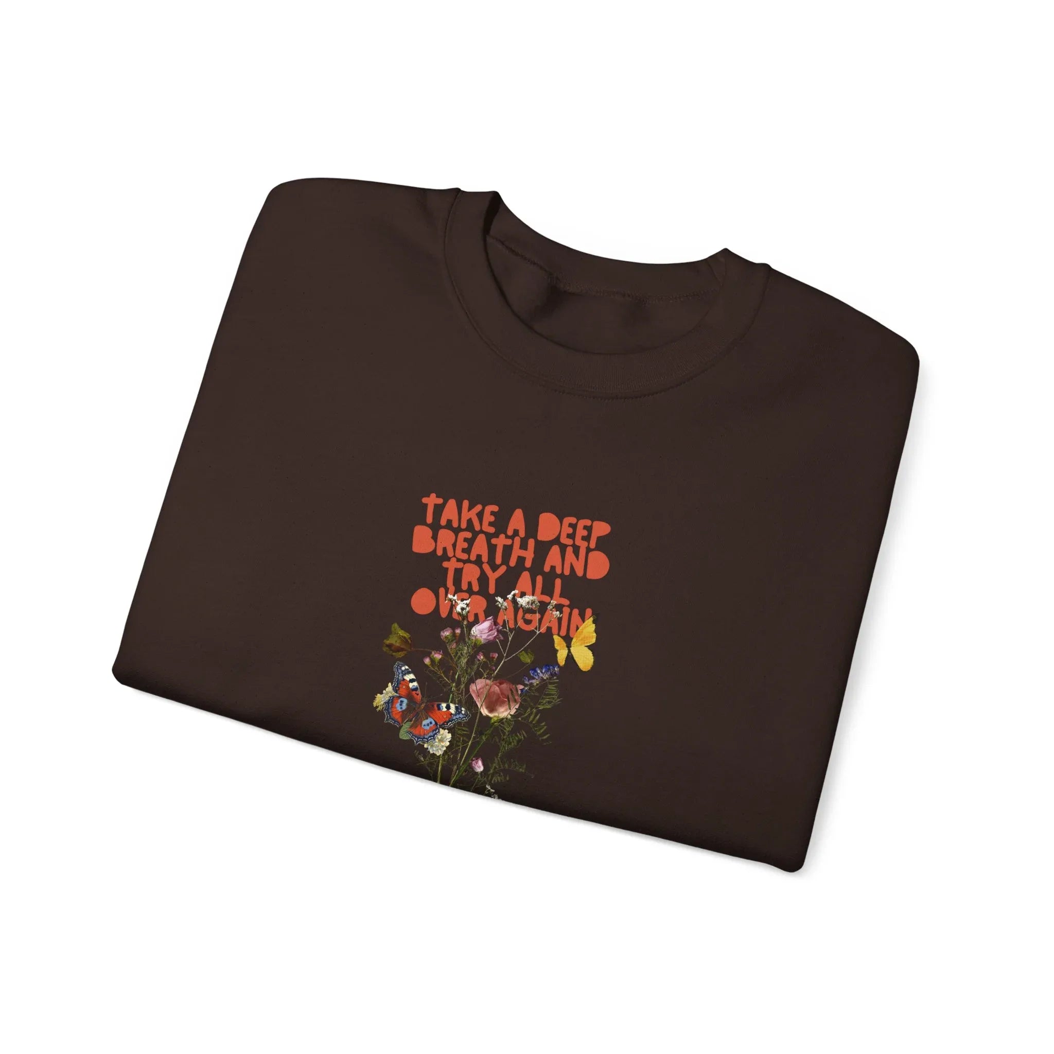 Dark brown crewneck sweatshirt with floral quote graphic on chest, crew neckline