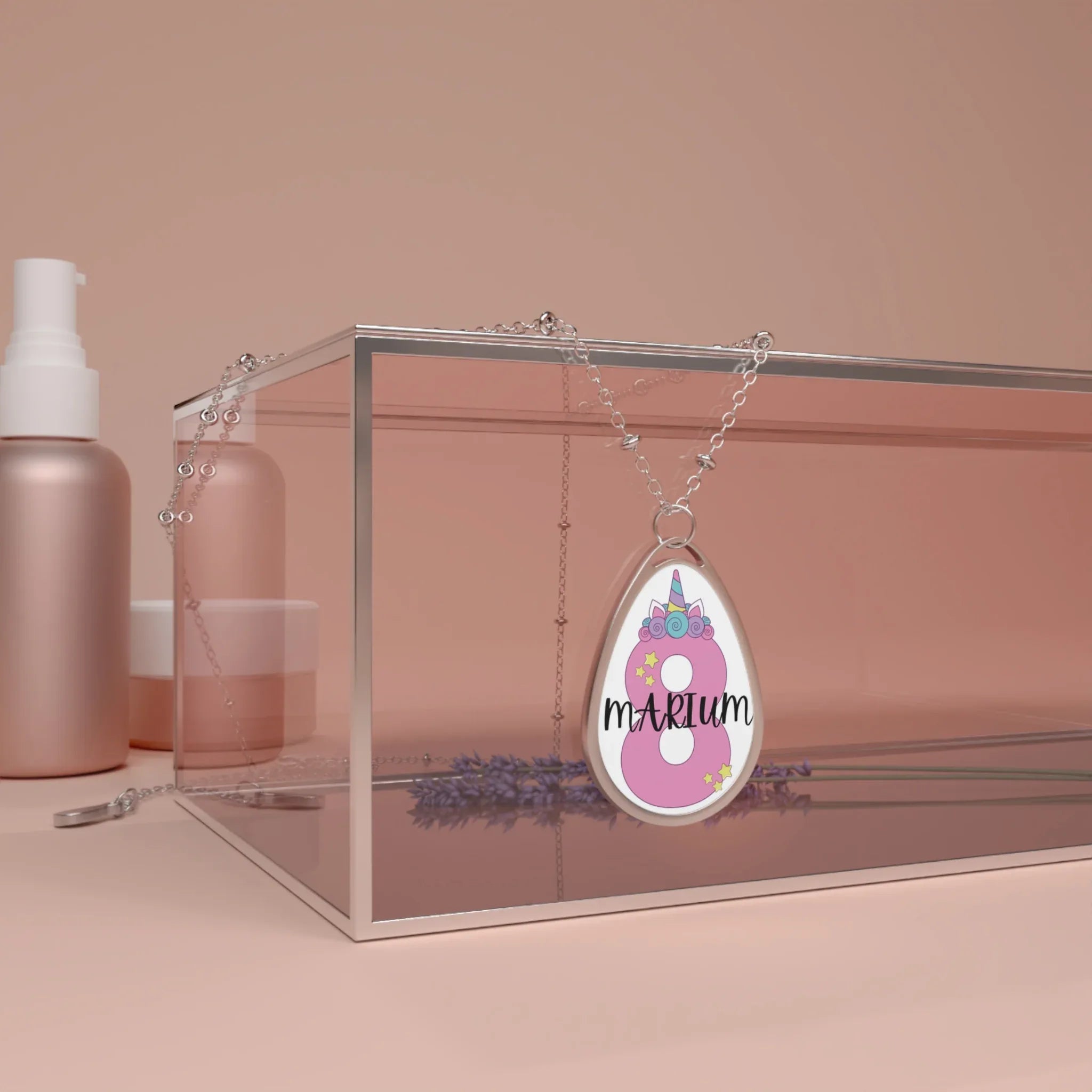 Silver chain necklace with unicorn-themed pink oval pendant reading "MARIUM"