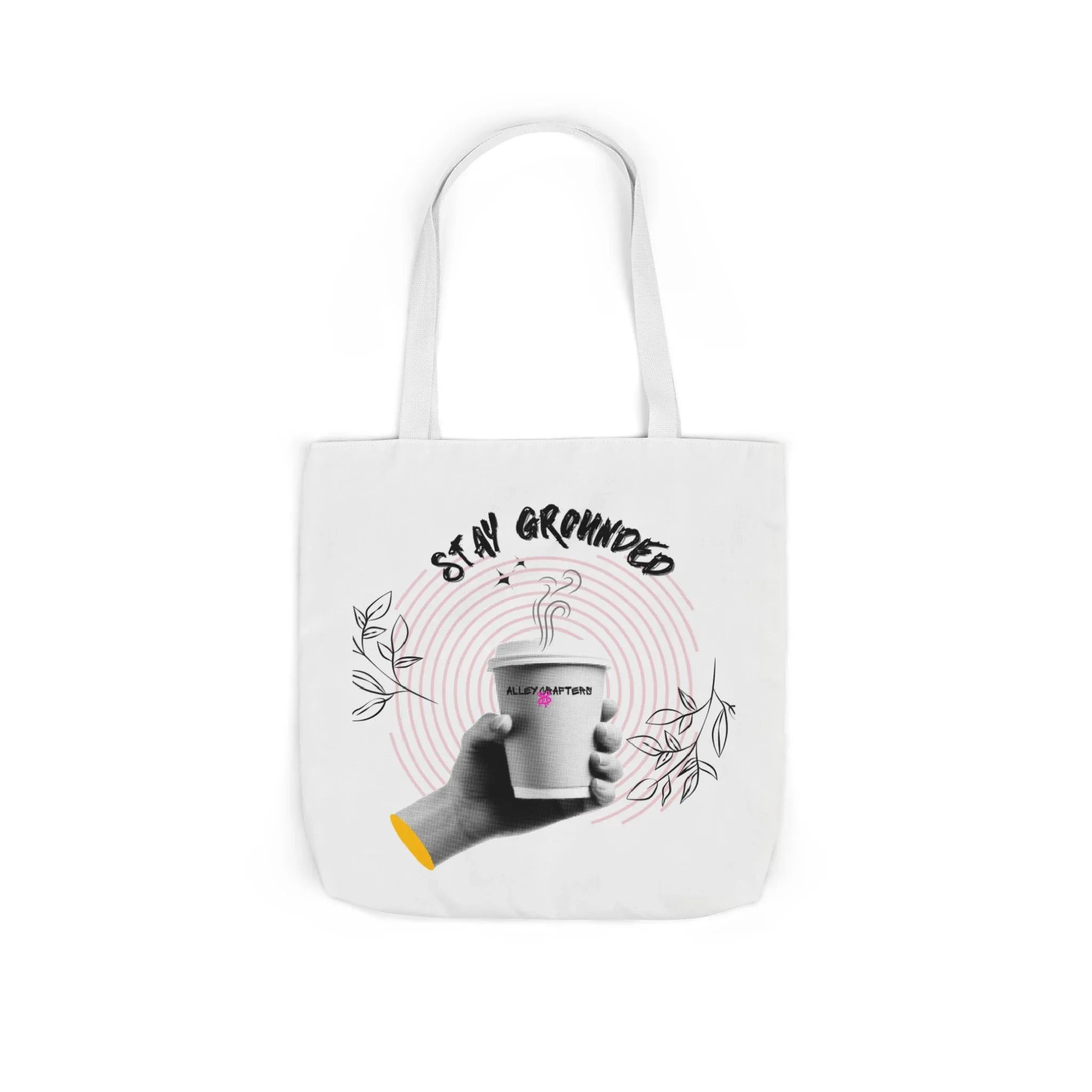 White coffee tote with white handles, centered “STAY GROUNDED” coffee mug print