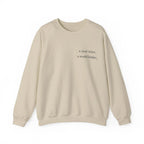 Beige crewneck sweatshirt with a year wiser, a world kinder print