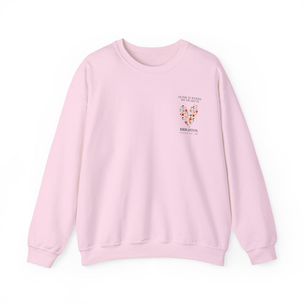 Light pink personalised sweatshirt with floral heart graphic and location text on chest